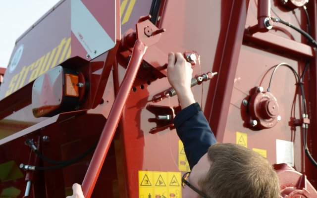 Regulowana osłona urządzenia rozprowadzającego